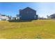 Large backyard with grassy area and a view of the neighborhood at 128 Baird Cv Ln, Angier, NC 27501