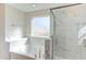 Bathroom with marble tile, soaking tub and glass shower at 128 Baird Cv Ln, Angier, NC 27501