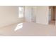 Bright bedroom featuring neutral carpeting and an adjacent closet at 128 Baird Cv Ln, Angier, NC 27501