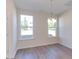 Bright dining area with hardwood floors and a chandelier at 128 Baird Cv Ln, Angier, NC 27501