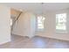 Bright dining area with hardwood floors and a chandelier at 128 Baird Cv Ln, Angier, NC 27501