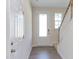 Bright entryway with white door, wood stairs, and laminate flooring at 128 Baird Cv Ln, Angier, NC 27501