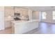 Modern kitchen with an island, stainless steel appliances, and light cabinets at 128 Baird Cv Ln, Angier, NC 27501