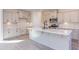 Modern kitchen with an island, stainless steel appliances, and light cabinets at 128 Baird Cv Ln, Angier, NC 27501