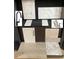 Kitchen and bathroom design samples, including flooring, cabinets, and countertops at 128 Baird Cv Ln, Angier, NC 27501