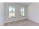 Spacious bedroom with neutral walls and carpeted floor at 133 Barn Door Dr, Lillington, NC 27546