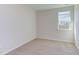 Simple bedroom with carpeted floor and a window at 133 Barn Door Dr, Lillington, NC 27546