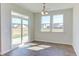 Bright breakfast nook with hardwood floors and sliding glass door at 133 Barn Door Dr, Lillington, NC 27546