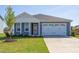 Newly constructed home with two-car garage and attractive landscaping at 133 Barn Door Dr, Lillington, NC 27546