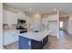 Modern kitchen with large island and stainless steel appliances at 133 Barn Door Dr, Lillington, NC 27546