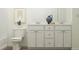 Clean bathroom featuring a double vanity and modern fixtures at 149 Kidderminster Ct, Zebulon, NC 27597
