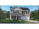 Two-story house with gray siding, white trim, and a two-car garage at 149 Kidderminster Ct, Zebulon, NC 27597
