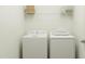 Laundry room with washer, dryer, and shelving for storage at 149 Kidderminster Ct, Zebulon, NC 27597