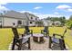 House with backyard, firepit, and seating area at 1505 Montvale Grant Way, Cary, NC 27519