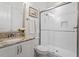 Clean bathroom with granite countertop, toilet, and a large shower at 1505 Montvale Grant Way, Cary, NC 27519