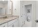Bathroom with granite countertop, single sink, and adjacent toilet at 1505 Montvale Grant Way, Cary, NC 27519