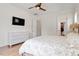 Bright bedroom with a comfortable bed, dresser, and large window at 1505 Montvale Grant Way, Cary, NC 27519