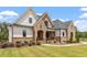 Brick and siding two-story house with landscaping at 1505 Montvale Grant Way, Cary, NC 27519