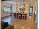 Spacious kitchen with large island, white cabinets, and hardwood floors at 1505 Montvale Grant Way, Cary, NC 27519