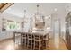 Gourmet kitchen with large island, stainless steel appliances, and white cabinetry at 1505 Montvale Grant Way, Cary, NC 27519