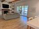 Bright living room features hardwood floors, fireplace, and sliding doors to patio at 1505 Montvale Grant Way, Cary, NC 27519