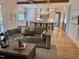 Open living area with hardwood floors and view of kitchen at 1505 Montvale Grant Way, Cary, NC 27519