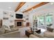 Living room with fireplace, built-in shelving and access to a back porch at 1505 Montvale Grant Way, Cary, NC 27519