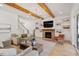 Living room with fireplace, built-in shelving, and access to a back porch at 1505 Montvale Grant Way, Cary, NC 27519