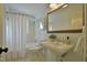 Updated bathroom with pedestal sink and a bathtub at 1514 Cumberland Rd, Chapel Hill, NC 27514