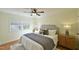 Bedroom with hardwood floors, ceiling fan, and neutral decor at 1514 Cumberland Rd, Chapel Hill, NC 27514