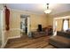 Living room with hardwood floors and view into kitchen at 1524 Wedgewood Dr, Graham, NC 27253