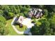 Luxury home with pool and large driveway, surrounded by lush landscaping and trees at 15508 Possum Track Rd, Raleigh, NC 27614