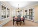 Basement dining area with french doors to patio at 15508 Possum Track Rd, Raleigh, NC 27614