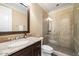 Bathroom with granite vanity, a large walk-in shower and tiled flooring at 15508 Possum Track Rd, Raleigh, NC 27614