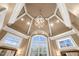 Stunning bathroom with a high ceiling, chandelier, and multiple windows at 15508 Possum Track Rd, Raleigh, NC 27614