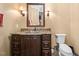 Basement bathroom with granite vanity and toilet at 15508 Possum Track Rd, Raleigh, NC 27614