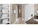 Clean bathroom with walk-in shower and linen closet at 15508 Possum Track Rd, Raleigh, NC 27614