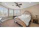Bright bedroom with bay windows and ornate bed frame at 15508 Possum Track Rd, Raleigh, NC 27614