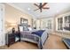 Comfortable bedroom with a treadmill, carpet flooring, and access to the outdoors at 15508 Possum Track Rd, Raleigh, NC 27614