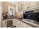 Butlers pantry with wine cooler, coffee bar and extra counter space at 15508 Possum Track Rd, Raleigh, NC 27614