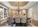 Spacious dining room, featuring a large table and chandelier at 15508 Possum Track Rd, Raleigh, NC 27614