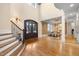 Elegant two-story entryway with hardwood floors and staircase at 15508 Possum Track Rd, Raleigh, NC 27614