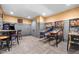 Basement game room with arcade games and seating area at 15508 Possum Track Rd, Raleigh, NC 27614