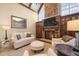 Spacious Gathering room features a stone fireplace and hardwood floors at 15508 Possum Track Rd, Raleigh, NC 27614
