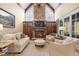 Cozy Gathering room with stone fireplace and built-in shelving at 15508 Possum Track Rd, Raleigh, NC 27614