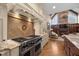 Modern kitchen features a statement backsplash and professional-grade range at 15508 Possum Track Rd, Raleigh, NC 27614