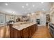 Large kitchen island with granite countertop, perfect for casual dining at 15508 Possum Track Rd, Raleigh, NC 27614