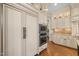 Well-equipped kitchen with built-in refrigerator and double ovens at 15508 Possum Track Rd, Raleigh, NC 27614
