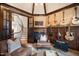 Music room with fireplace, staircase view, and various guitars at 15508 Possum Track Rd, Raleigh, NC 27614