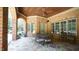 Covered patio with seating and flagstone flooring at 15508 Possum Track Rd, Raleigh, NC 27614